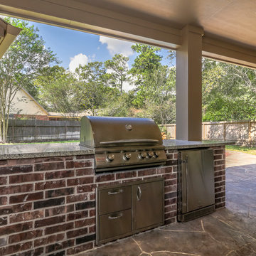 Stone Patio with Outdoor Kitchen and Pool