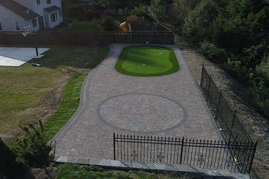 Putting Green and Paving Stone Patio by Aguiar Pavers, LLC