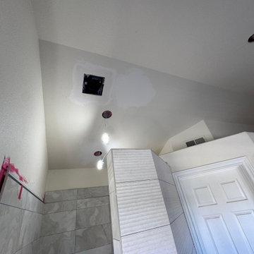 Curd-less walk-in shower; heated floors in bathroom + shower+bench LED