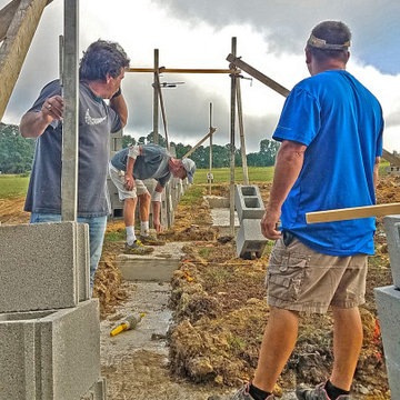 Masonry Crew setting up Corner Poles