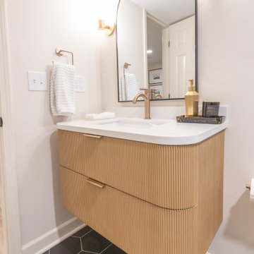 Warm & Inviting Basement Retreat with Custom Bar + Entertainment Center