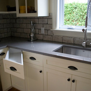 Mid-sized transitional kitchen pantry remodeling - Inspiration for a mid-sized transitional u-shaped light wood floor kitchen pantry remodel in Montreal with a drop-in sink, shaker cabinets, white cabinets, quartzite countertops, gray backsplash, cement tile backsplash, stainless steel appliances and an island