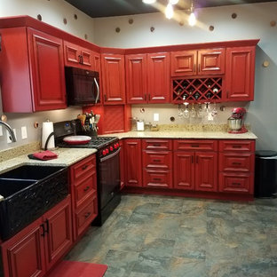 Kitchen pantry pictures - Kitchen pantry - l-shaped slate floor and multicolored floor kitchen pantry idea in Cedar Rapids with a double-bowl sink, beaded inset cabinets, red cabinets, black appliances, no island and brown countertops