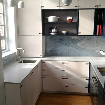 Blue Calcite quartzite splashbacks with Compac Ice Zement worktops