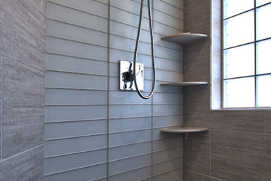 Inspiration for a large contemporary master gray tile and glass tile gray floor corner shower remodel in Other with gray walls