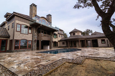 Example of a mid-sized transitional beige three-story vinyl exterior home design in Other with a tile roof