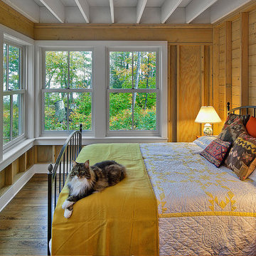 Antique Elm Flooring in a Cozy Forest View Bedroom