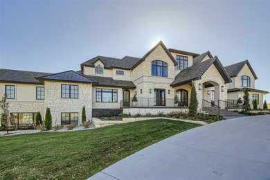Example of a classic white two-story house exterior design in Denver with a gray roof