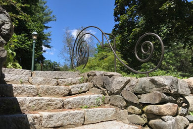 This is an example of a small rustic retaining wall landscape in Boston.