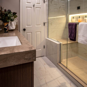 Spa Bath with Tile Steam Shower, Walnut Cabinetry and Solid Surface Countertops