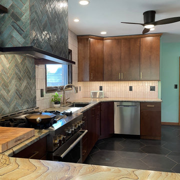 Birch Slab Door Kitchen with Green Tile, Hypnose Stone Tops, and MCM Lighting