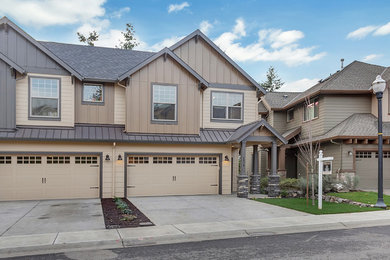 Mid-sized transitional beige two-story concrete fiberboard gable roof photo in Portland
