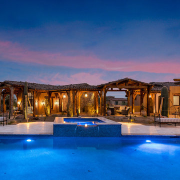 Illuminated Pool and Spa with Covered Patios