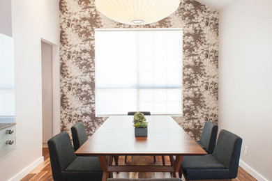 Large trendy brown floor enclosed dining room photo in Orange County with white walls and no fireplace