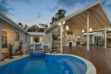 This is an example of a beach style pool in Gold Coast - Tweed.