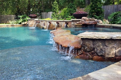 Pool fountain - large transitional backyard custom-shaped pool fountain idea in Oklahoma City