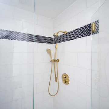 Horizontal shower feature strip created with penny round mosaic tile