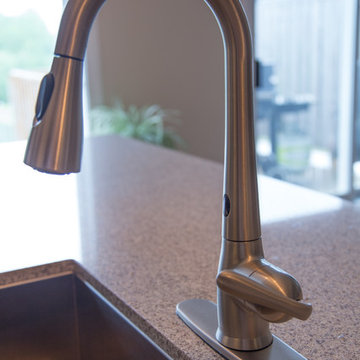 Falsetta - Brown Cabinets with Mosaic Tile Backsplash