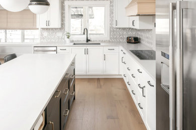 Example of a trendy kitchen design in Vancouver with quartzite countertops, blue backsplash, marble backsplash, stainless steel appliances and white countertops