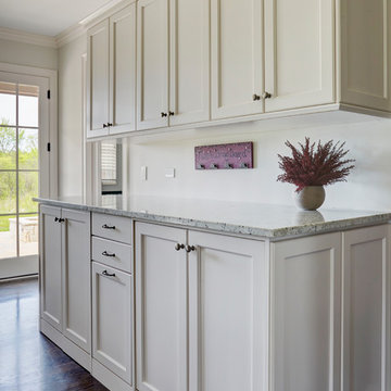 Washer Dryer Concealed with White Cabinetry