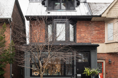 Example of a transitional exterior home design in Toronto