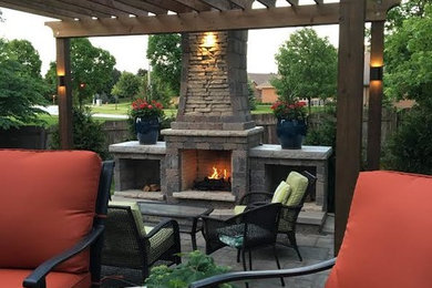 Outdoor Fireplace, 2 level patio, retaining walls and an outdoor kitchen