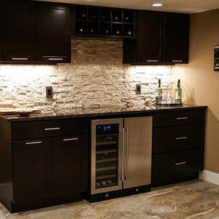Medium sized contemporary fully buried basement in Denver with beige walls, carpet, a corner fireplace, a stone fireplace surround and beige floors.