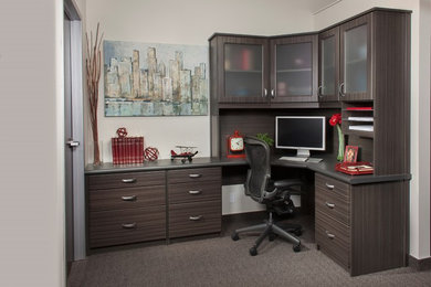 Mid-sized minimalist built-in desk carpeted study room photo in Toronto with white walls