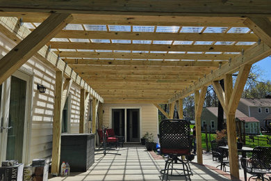 Large minimalist concrete patio photo in Charlotte