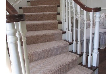 Staircase - mid-sized coastal carpeted curved staircase idea in Los Angeles with carpeted risers
