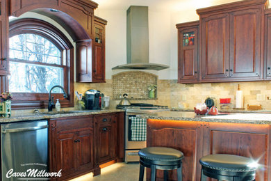 Inspiration for a mid-sized transitional u-shaped ceramic tile and beige floor enclosed kitchen remodel in New York with an undermount sink, raised-panel cabinets, dark wood cabinets, quartz countertops, beige backsplash, ceramic backsplash, stainless steel appliances, an island and beige countertops