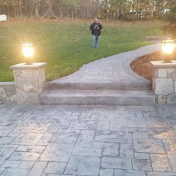 T-Stamped concrete patio, flagstone wall with columns
