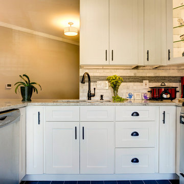White Kitchen Remodel with Colonial White Granite and Stainless Steel Appliances