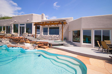 Mid-sized tuscan white one-story stucco exterior home photo in Phoenix with a mixed material roof
