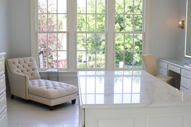 Inspiration for a huge contemporary master marble floor and white floor bathroom remodel in Other with flat-panel cabinets, white cabinets, a one-piece toilet, white walls, a drop-in sink, marble countertops, a hinged shower door and white countertops