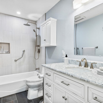 Elegant Guest Bathroom Makeover with White Vanity and Tub-Shower Combo