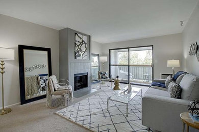 Inspiration for a small 1950s enclosed carpeted living room remodel in San Francisco with gray walls, a standard fireplace and a tile fireplace