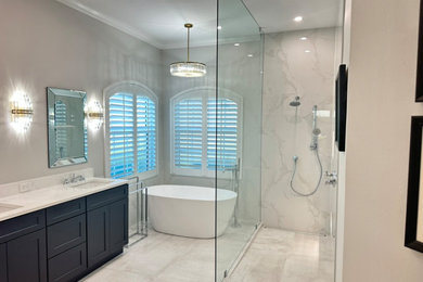Bathroom - large master white tile and porcelain tile porcelain tile, gray floor and double-sink bathroom idea in Tampa with shaker cabinets, black cabinets, a one-piece toilet, gray walls, an undermount sink, quartzite countertops, white countertops, a niche and a built-in vanity