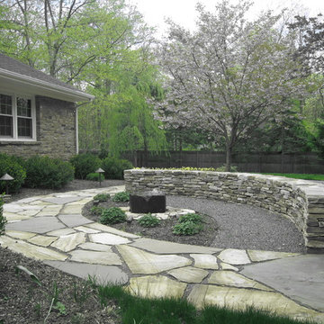 gentle water sound softens the road noise, stone wall marries house and garden