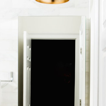 White Marble Bathrooms with Faux Wood Floors