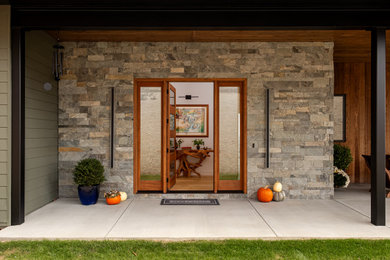 Mid-sized contemporary exterior home idea in Other