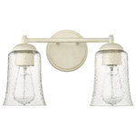 Millennium Lighting - 2 Light 15 in. Cottage White Vanity Light - Vintage-inspired, tapered, bell-shaped seedy glass globes give the Abilene Family of vanity lighting an unparalleled design signature rooted in turn-of-the-century American design. Finished in either matte black or cottage white, these fixtures are available in 1-light, 2-light, and 3-light options and are further embellished with stylish brushed gold sockets.