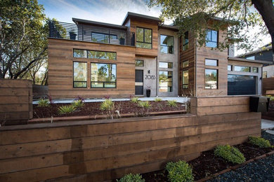 Inspiration for a large modern multicolored two-story mixed siding exterior home remodel in San Francisco with a metal roof