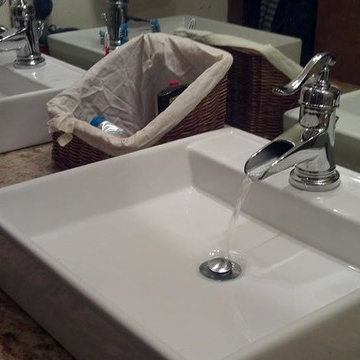Diamond Cabinetry w/Colonial Gold Granite and Travertine Tub Surround