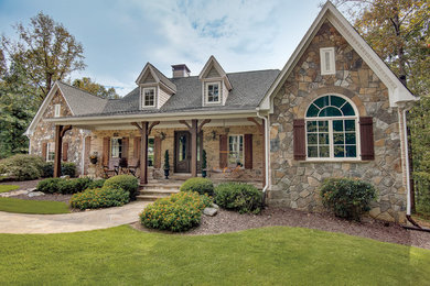 Inspiration for a rustic beige one-story mixed siding exterior home remodel in Columbus with a shingle roof