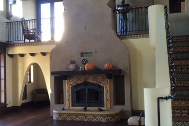 Living room photo in Los Angeles with a tile fireplace