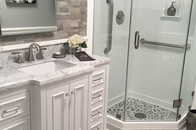 Inspiration for a timeless white tile bathroom remodel in Los Angeles with an undermount sink, furniture-like cabinets, beige cabinets and marble countertops