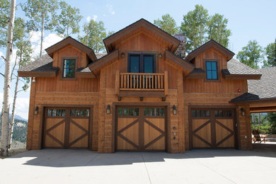 Large mountain style detached garage workshop photo in Denver