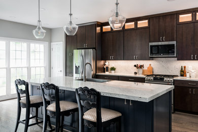 Example of a mid-sized transitional kitchen design in Charlotte with an island