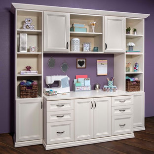 Photo of a medium sized modern craft room in Salt Lake City with purple walls and a freestanding desk.